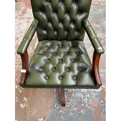 151D - A green leather and mahogany Chesterfield swivel office desk chair - approx. 96cm high x 61cm wide x... 