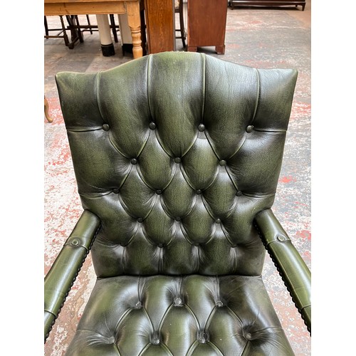 151D - A green leather and mahogany Chesterfield swivel office desk chair - approx. 96cm high x 61cm wide x... 