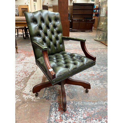 151E - A green leather and mahogany Chesterfield swivel office desk chair - approx. 96cm high x 61cm wide x... 