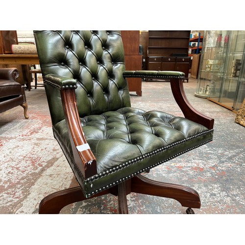 151E - A green leather and mahogany Chesterfield swivel office desk chair - approx. 96cm high x 61cm wide x... 