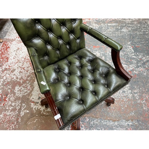 151E - A green leather and mahogany Chesterfield swivel office desk chair - approx. 96cm high x 61cm wide x... 