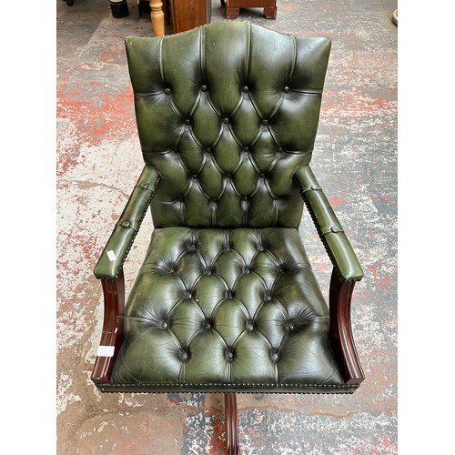 151E - A green leather and mahogany Chesterfield swivel office desk chair - approx. 96cm high x 61cm wide x... 