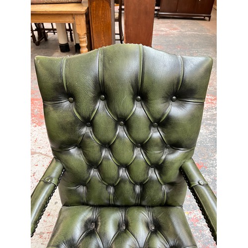 151E - A green leather and mahogany Chesterfield swivel office desk chair - approx. 96cm high x 61cm wide x... 