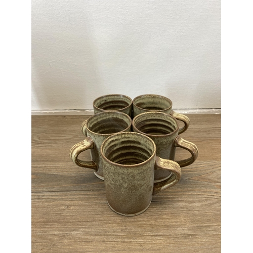 229 - A studio pottery fourteen piece coffee set