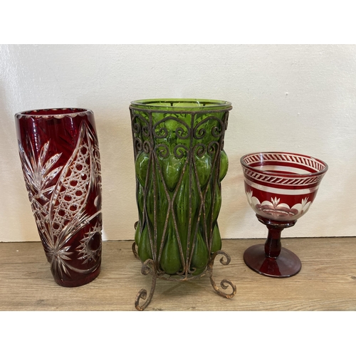 267 - A collection of glassware to include uranium pedestal dish, Bohemian ruby red vase, claret jug with ... 