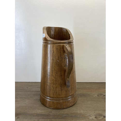 272 - A vintage oak jug shaped stick stand - approx. 49cm high