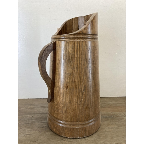 272 - A vintage oak jug shaped stick stand - approx. 49cm high