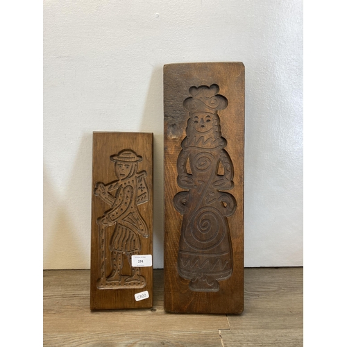 274 - Seven mid/late 20th century carved treen gingerbread moulds - largest approx. 52cm high