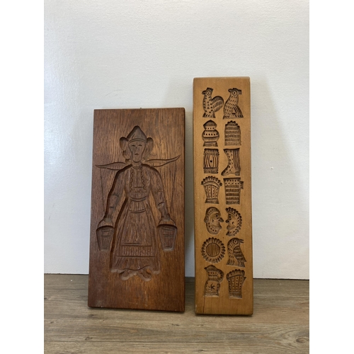 274 - Seven mid/late 20th century carved treen gingerbread moulds - largest approx. 52cm high