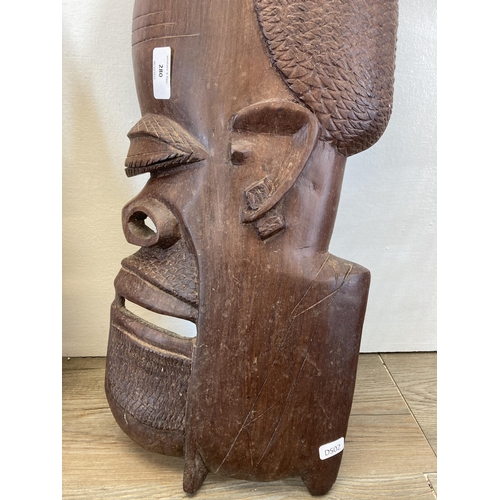 280 - A pair of African Tribal style carved hardwood wall masks - approx. 62cm high x 25cm wide