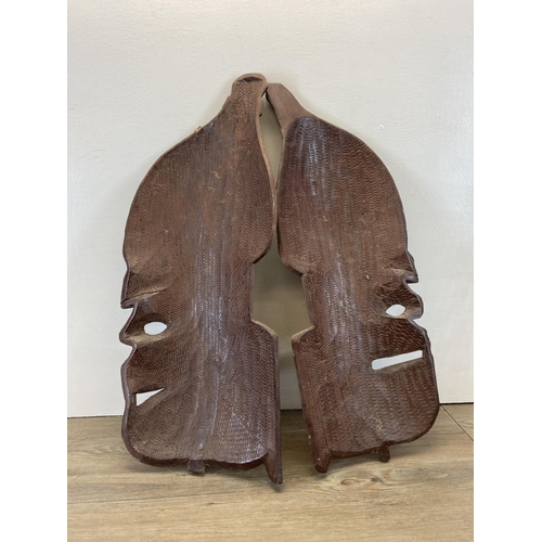 280 - A pair of African Tribal style carved hardwood wall masks - approx. 62cm high x 25cm wide