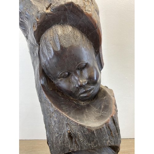 281 - An African carved hardwood sculpture - approx. 55cm high