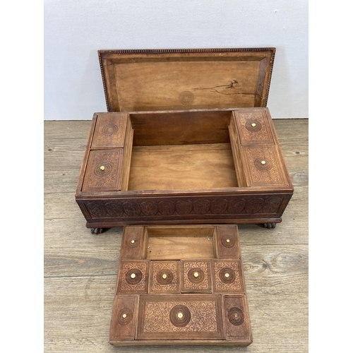 287 - A well carved Indian teak rectangular spice box with lion paw feet and bird and foliate design - app... 