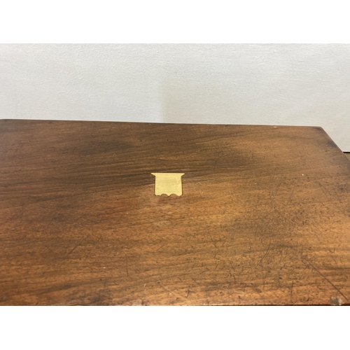 288 - A 19th century mahogany writing slope with brass cartouche and escutcheon - approx. 16cm high x 40cm... 