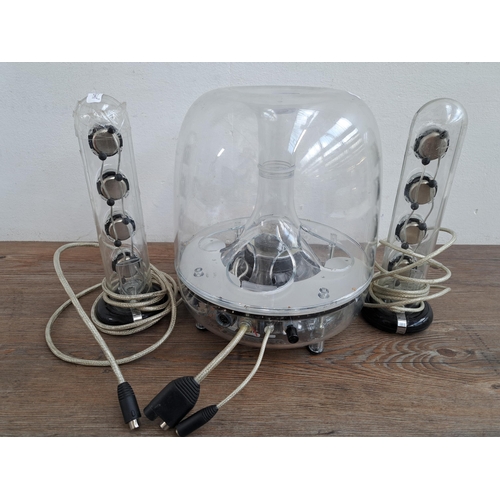 A Harman/Kardon SoundSticks III speaker system comprising A Harman/Kardon SoundSticks III speaker system comprising