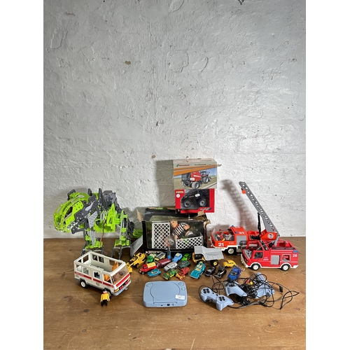 327 - A collection of toys and model vehicles to include boxed Britains New Holland T7.270 Golden Jubilee ... 