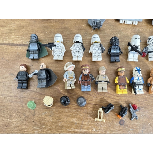 339 - A collection of Star Wars Lego to include Stormtrooper figurines, Darth Vader figurines, Tie Bomber,... 