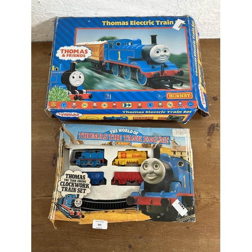 341 - Three items, two boxed Hornby Thomas The Tank Engine train sets, one clockwork and one electric and ... 