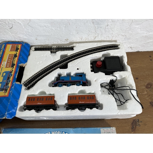 341 - Three items, two boxed Hornby Thomas The Tank Engine train sets, one clockwork and one electric and ... 