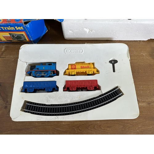 341 - Three items, two boxed Hornby Thomas The Tank Engine train sets, one clockwork and one electric and ... 