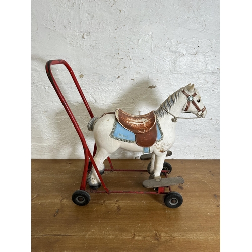 342 - A mid 20th century Tri-Ang push along horse - approx. 60cm high x 26cm wide x 49cm deep