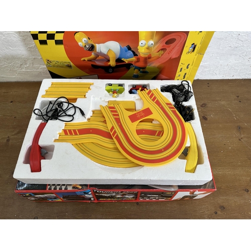 348 - Two boxed Scalextric slot car sets, one Tourers 2000 and one The Simpsons Skateboard Chase