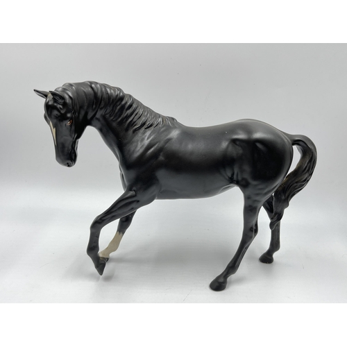 192 - Three Beswick horse figurines to include Black Beauty and Foal etc.