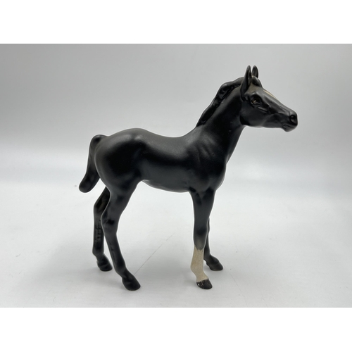 192 - Three Beswick horse figurines to include Black Beauty and Foal etc.