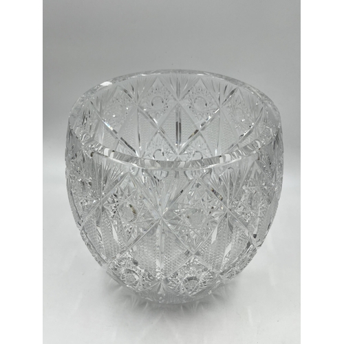 198 - A Bohemian pinwheel cut crystal vase - approx. 19cm diameter x 21cm high