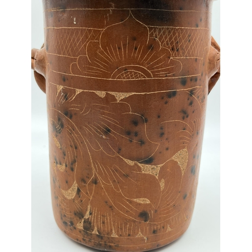 205 - A vintage terracotta utensil holder with engraved floral motifs - approx. 20cm high x 15cm diameter