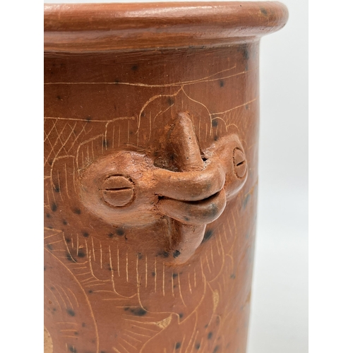 205 - A vintage terracotta utensil holder with engraved floral motifs - approx. 20cm high x 15cm diameter