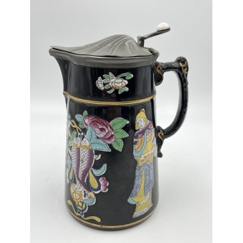 212 - A 19th century Dudson Jetware chinoiserie jug with pewter lid - approx. 17cm high