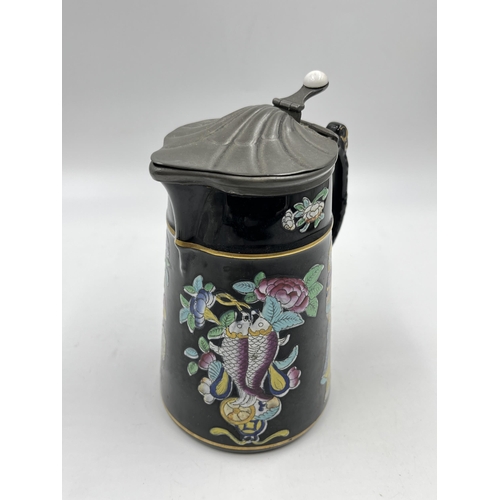 212 - A 19th century Dudson Jetware chinoiserie jug with pewter lid - approx. 17cm high