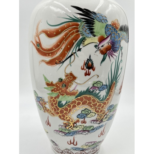 225H - A Chinese hand painted porcelain baluster vase - approx. 27cm high