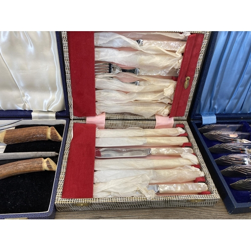 318 - Four cased cutlery sets