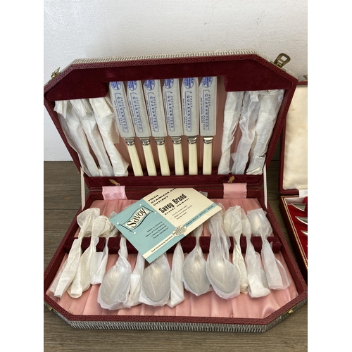 319 - Three cased cutlery sets