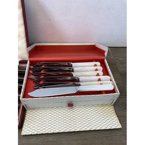 319 - Three cased cutlery sets