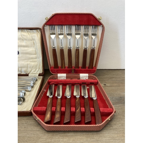 320 - Three cased cutlery sets