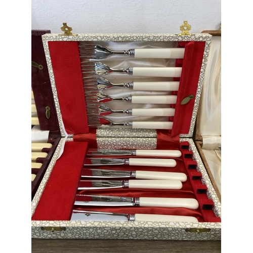 321 - Three cased cutlery sets