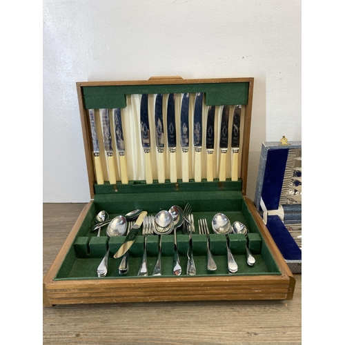 322 - Three cased cutlery sets