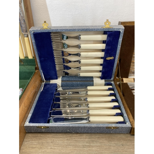 322 - Three cased cutlery sets