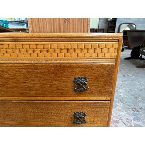 114A - A mid 20th century oak chest of drawers - approx. 70cm high x 91cm wide x 45cm deep