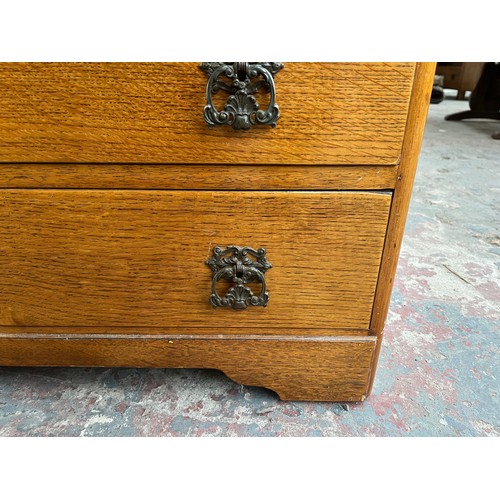 114A - A mid 20th century oak chest of drawers - approx. 70cm high x 91cm wide x 45cm deep