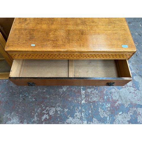 114A - A mid 20th century oak chest of drawers - approx. 70cm high x 91cm wide x 45cm deep