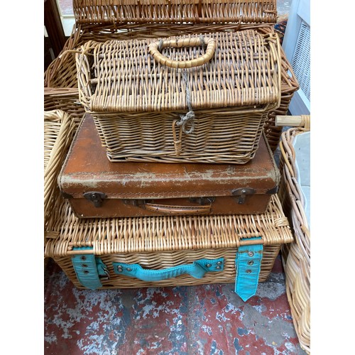 123 - Seven items, six wicker baskets and one vintage brown leather travel case