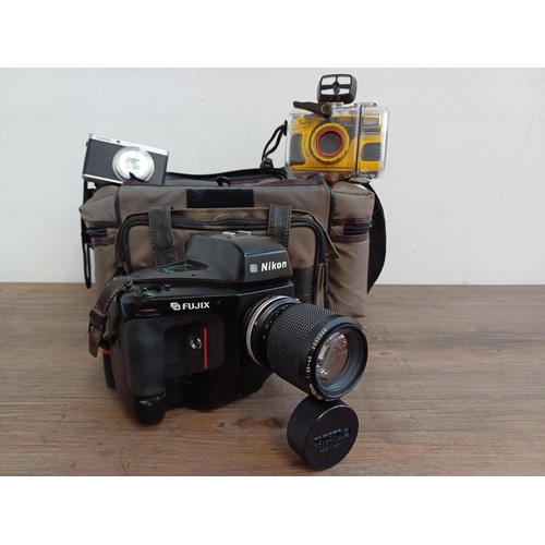 619 - A camera case containing mid 1990s Nikon Fujix E2s (3fps version of the E2) DSLR camera fitted with ... 