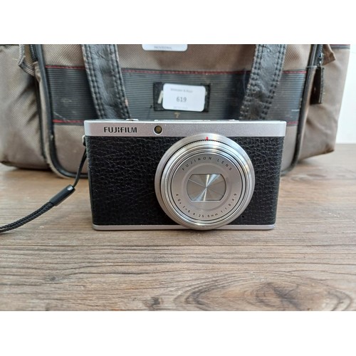 619 - A camera case containing mid 1990s Nikon Fujix E2s (3fps version of the E2) DSLR camera fitted with ... 