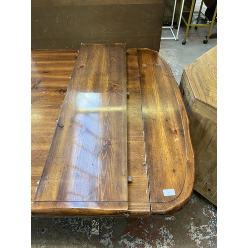 11 - A pine twin pedestal extending dining table - approx. 73cm high x 106cm wide x 191cm long not extend... 