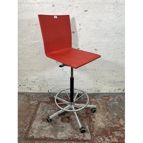 52 - A Vitra .04 red plastic and metal counter chair designed by Maarten Van Severen - approx. 122cm high... 