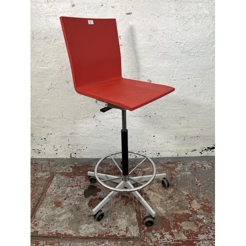 53 - A Vitra .04 red plastic and metal counter chair designed by Maarten Van Severen - approx. 122cm high... 